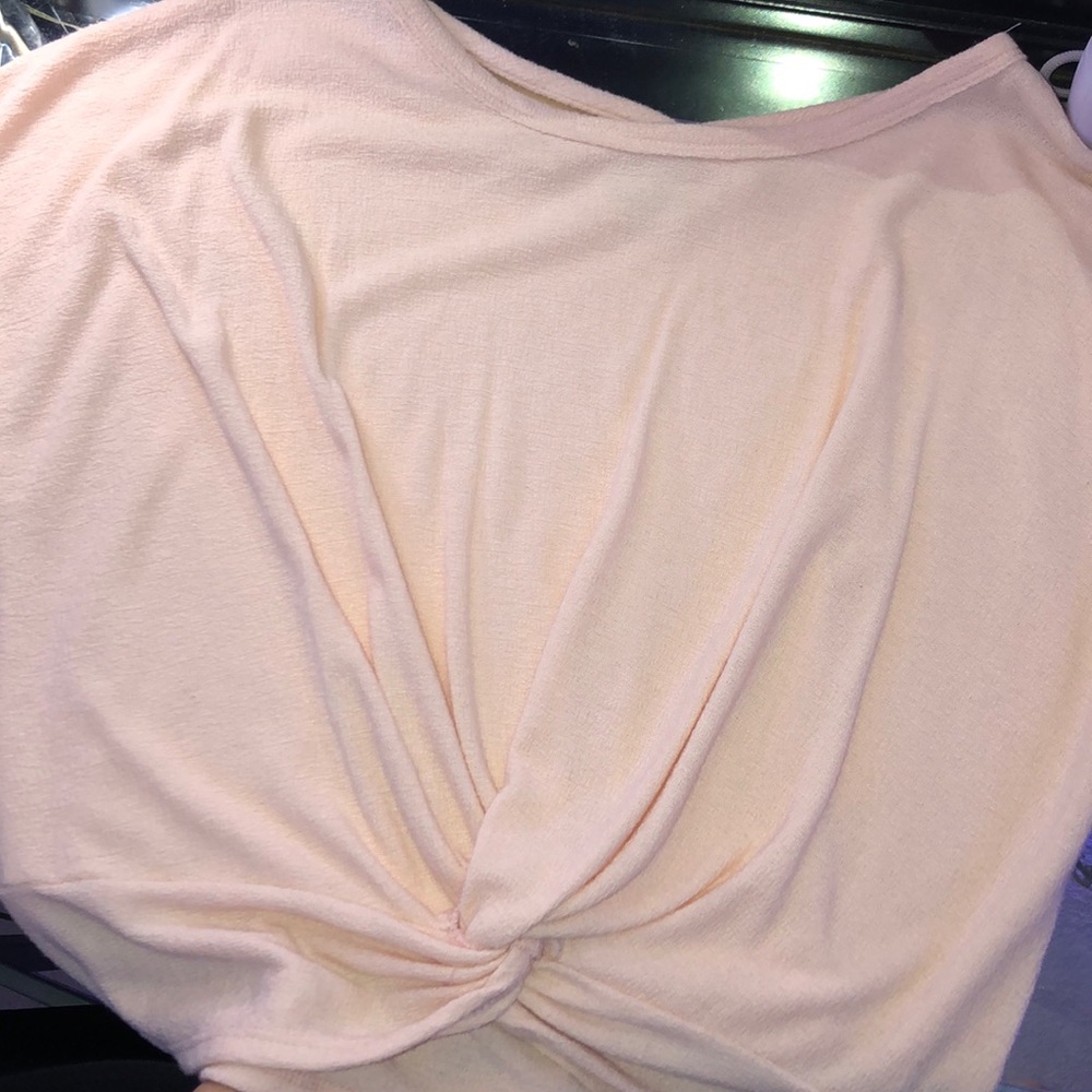 light pink shirt, crop top-ish